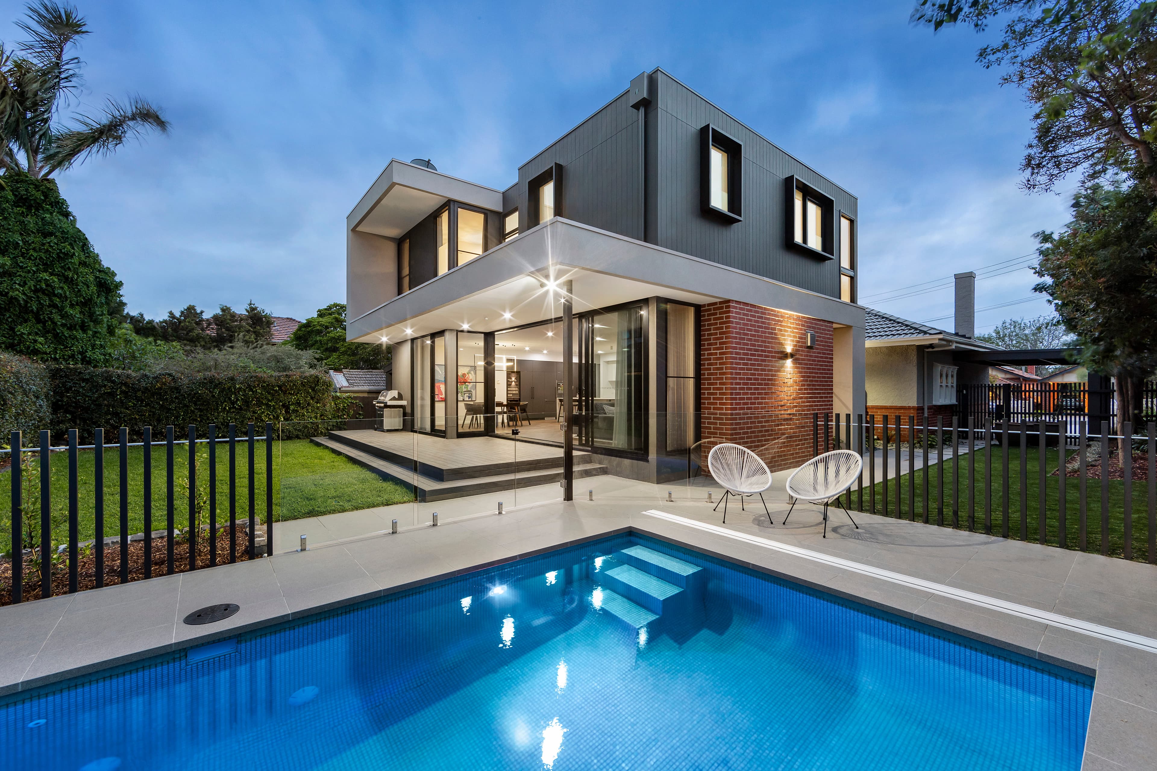 Photorealistic AI render of a two-storey modern house and pool at twilight, generated from a SketchUp model