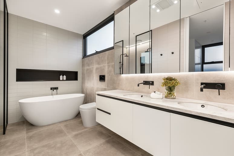Bathroom with a freestanding tub and a double vanity