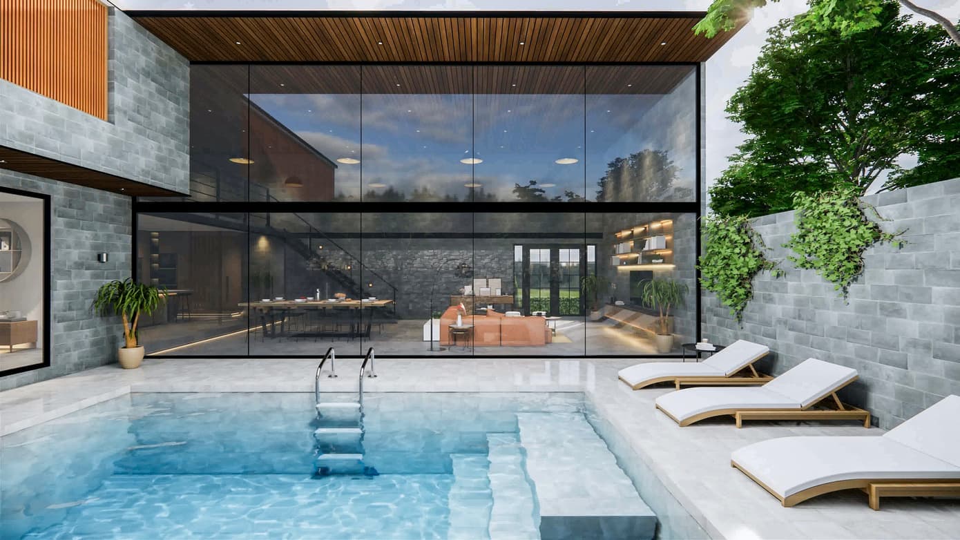 Pool beside a glass-walled house with sun loungers