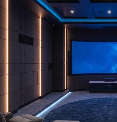 Home cinema with LED strip lighting and recliners