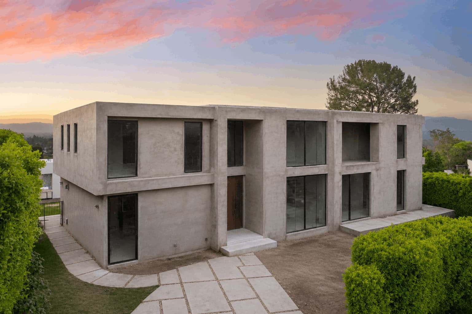 Photorealistic exterior render of a modern concrete house