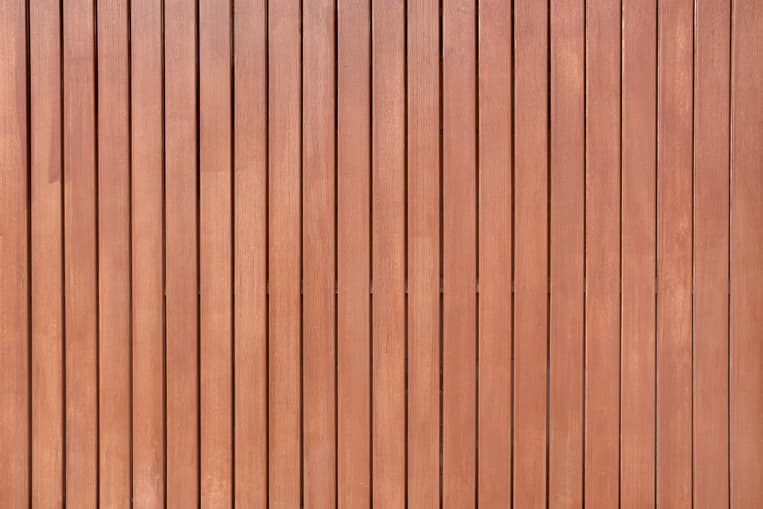 Stucco render and timber cladding textures side by side