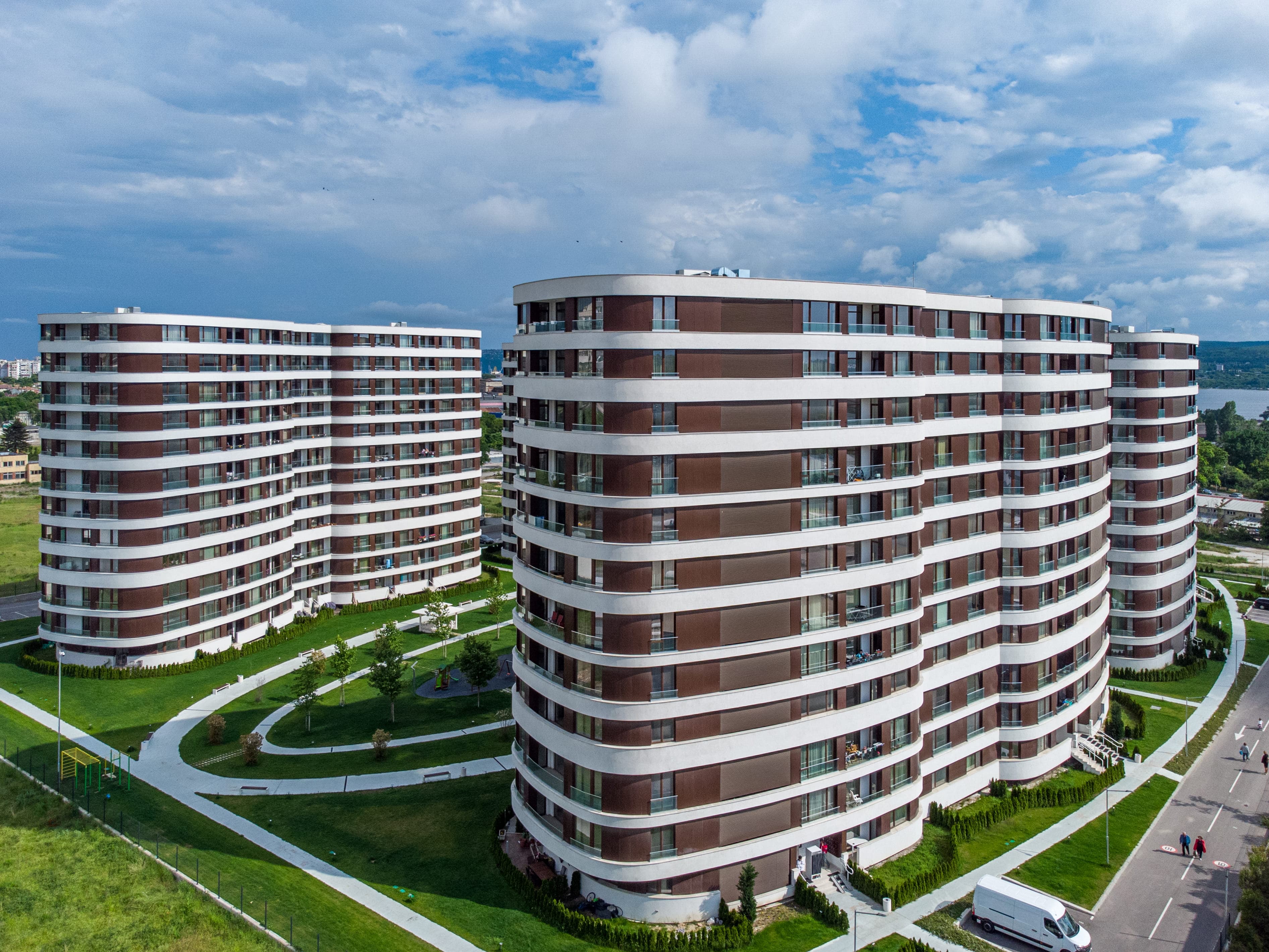 Curved residential towers set in landscaped grounds